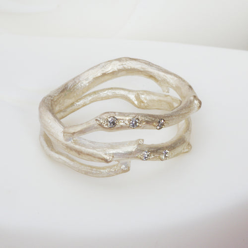 a silver and diamond organic ring